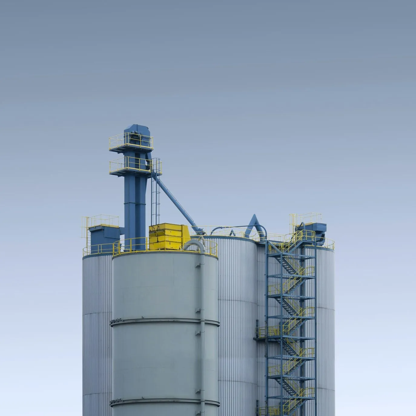A white concrete building against a clear sky